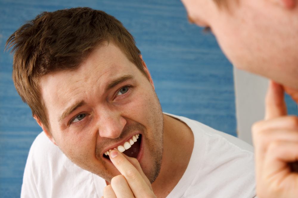 loose tooth causes symptoms treatement